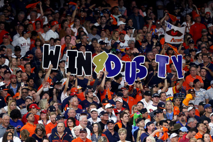 Astros fans hold up signs to support manager Dusty Baker